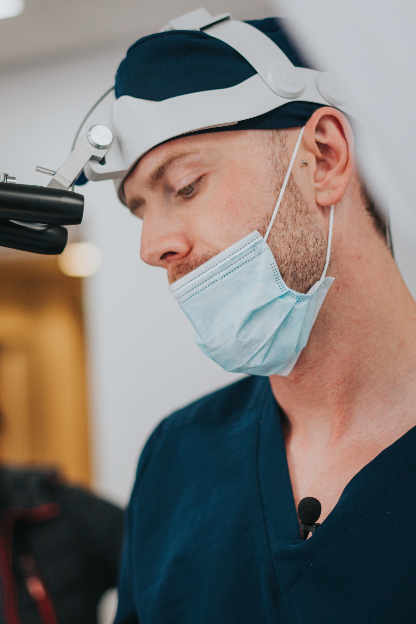 Dr Jamie Harrison performing a hair transplant procedure in the clinic