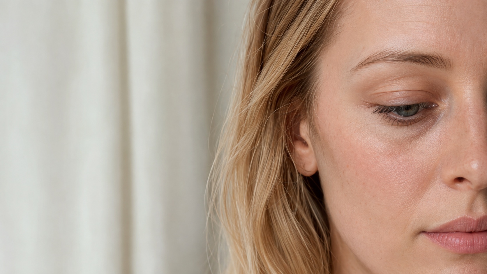Close view of a woman’s natural under-eye and upper-cheek area